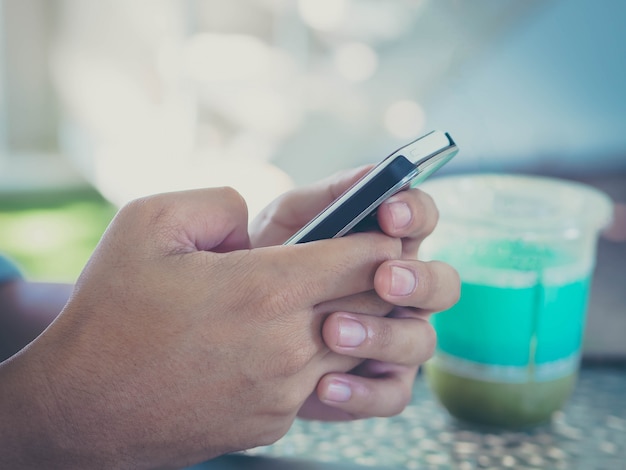 Man hand holding smartphone