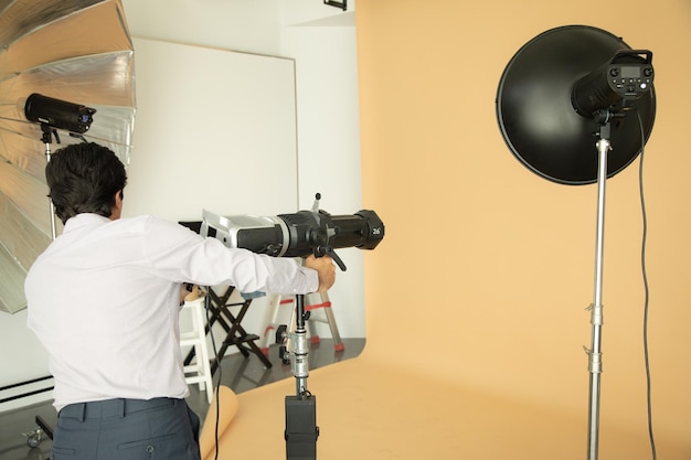 Man hand lights in photo studio