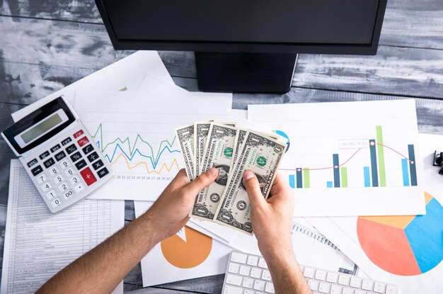 Man hand money on office desk