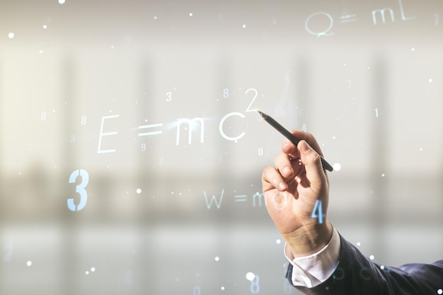 Man hand with pen working with scientific formula illustration on blurred office background science and research concept Multiexposure