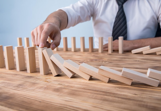 Man hand wooden cubes