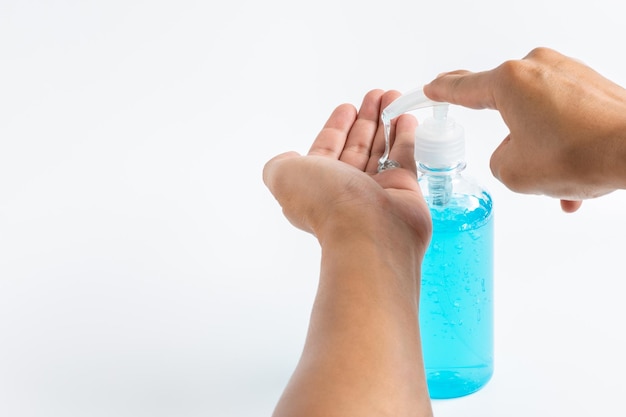 Man hands applying alcohol hand sanitizer gel for prevent spread of virus bacteria and germs COVID19