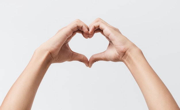 Man hands making a heart shape on a white isolated background