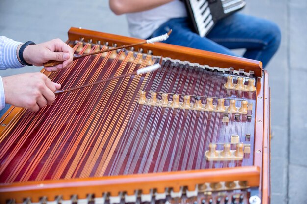 Man hands playing on a harp the Ukrainian national musical instrument close up Lviv Ukraine