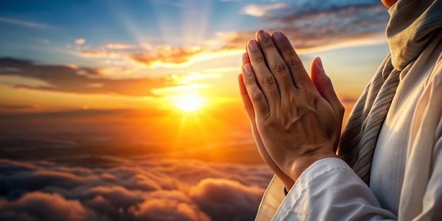 man hands praying for blessing from god on sunset background