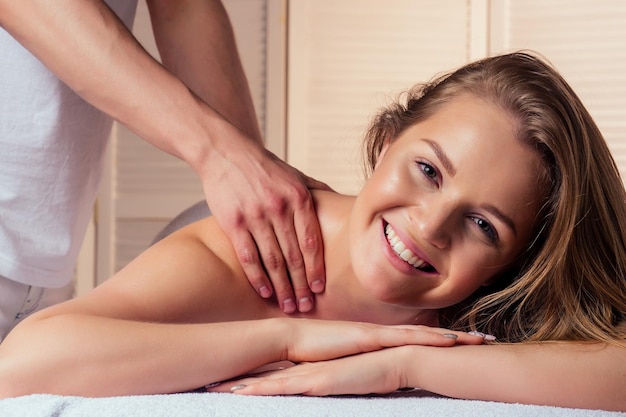 Man hands treatmentmale having massage in the spa salon for beautiful girl