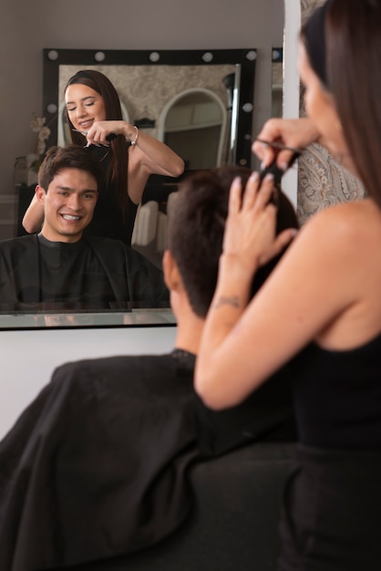 Man having hair cut at latino hair salon