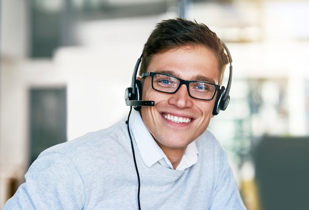 Photo man headset and happy in workplace with portrait as virtual assistant communication staff and employee male person confident and smile in technical support call center and customer service agent