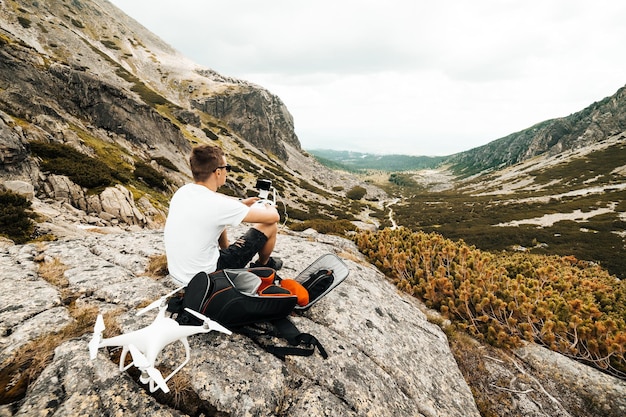 Man hiking in Pyrenees' mountains. He observes the place.