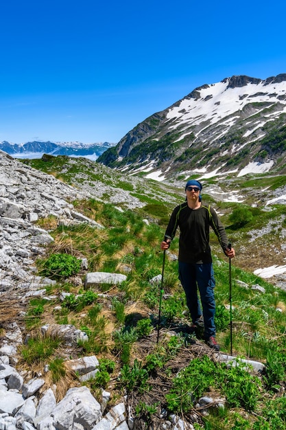 The man hiking in the tropical forest mountians