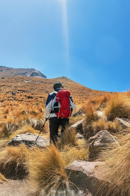 A man on his way to the top of the mountain Copy space for text