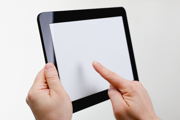 Man hoding black tablet frame in hand