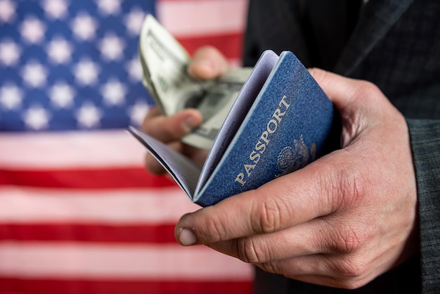 Man hold US passport with dollar for business or travel