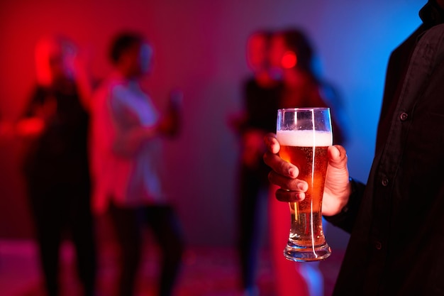 Man Holding Beer in Club