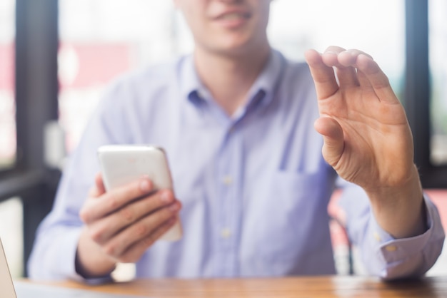 man holding blank business card in office, business concept