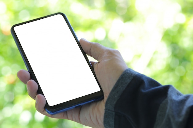 A man holding blank screen smartphone for graphic.