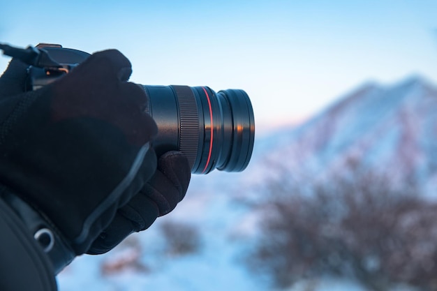 Man holding camera in snowy nature