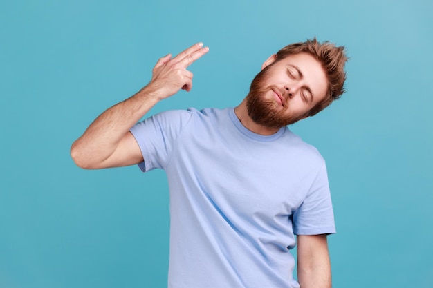 Man holding fingers near temple pretending holding gun going to make shot faced with problem