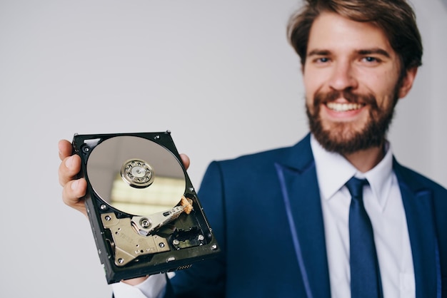 Man holding a hard drive information protection technology