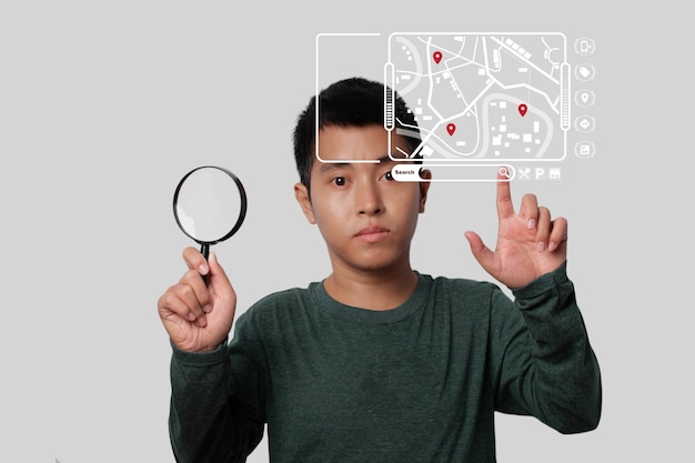 Man holding magnifying glass and point virtual model map with location point