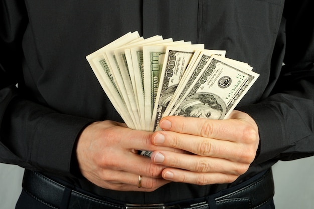 Man holding money in hands dollar usa