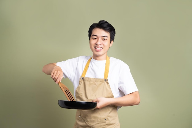 Man holding a pan on the background