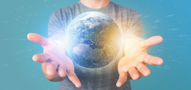 Photo man holding a  particles earth globe