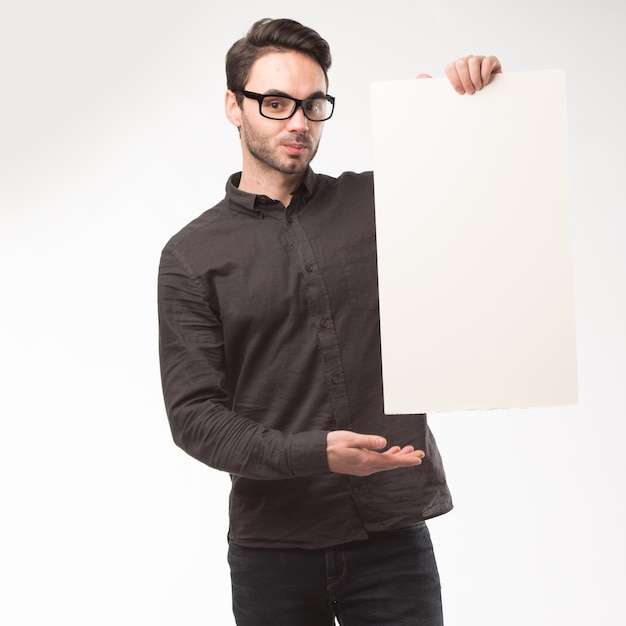 Photo a man holding a piece of paper that says quot he is holding a piece of paper quot