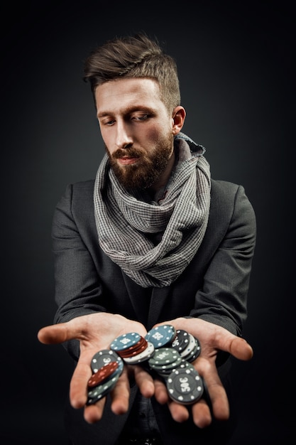 Man holding poker chips