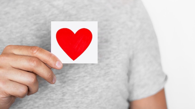 Man holding a red heart Romantic man Message Love The senses