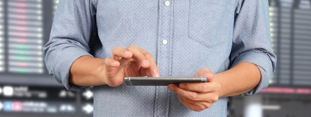 Man holding smartphone device and touching screen