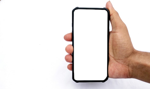 A man holding smartphone with blank screen on white background, closeup of hand. Space for text