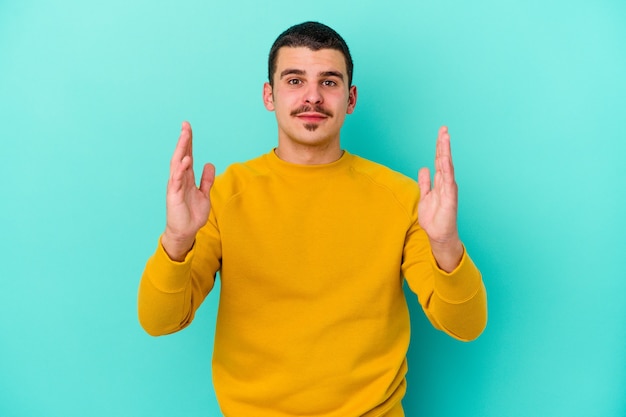 man holding something little with forefingers