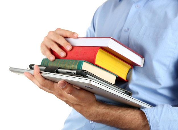 Man holding stack of books with laptop and tablet isolated on white