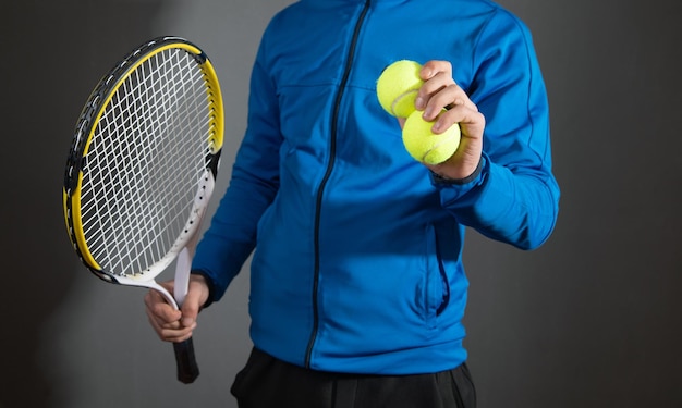 Man holding tennis ball and racket Sport Hobby