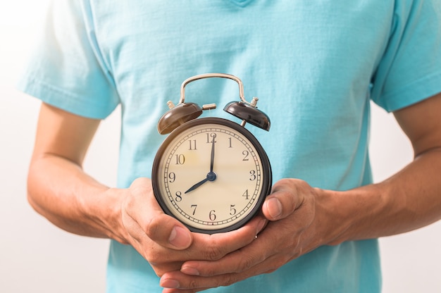 A man holding a watch