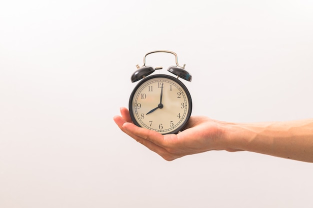 A man holding a watch