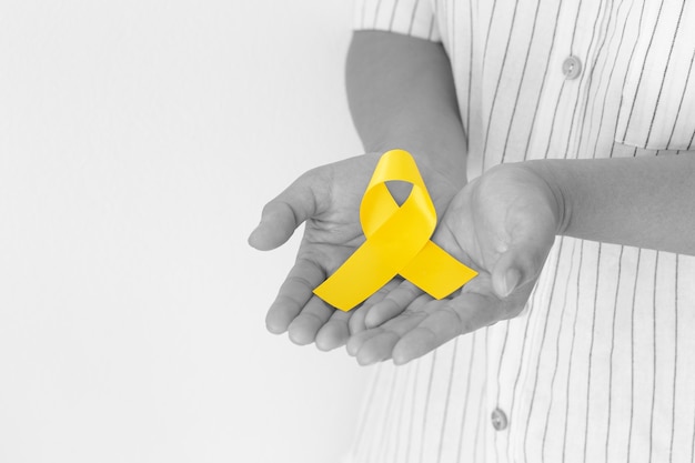 Man holding yellow ribbon