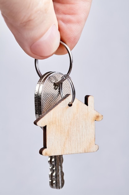 A man holds the keys to a new apartment