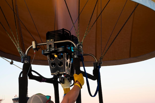 A man is attached to a parachute with the parachute attached to it.