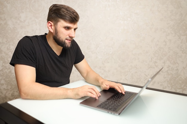 a man is busy with important work on a laptop