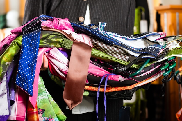 Man is buying Tracht or dirndl in a shop