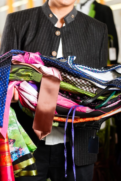 Man is buying Tracht or dirndl in a shop