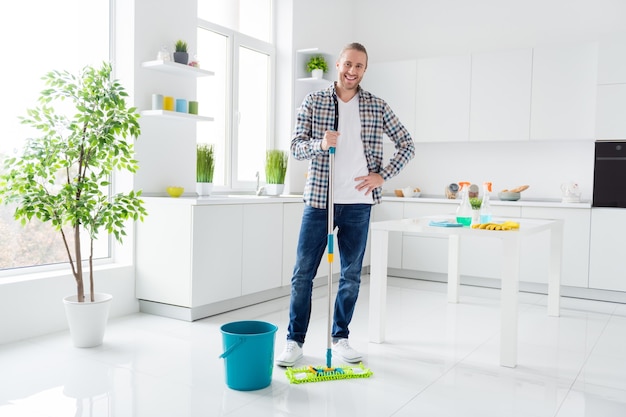 man is cleaning the modern kitchen