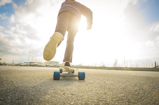 Man is going to skateboarding on the road - caucasian people - people, sport and skateboarding concept