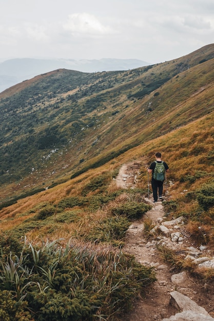 Man is hiking from mountain Hoverla. Carpathian mountains.