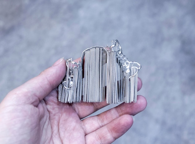 Man is holding object printed on metal 3d printer