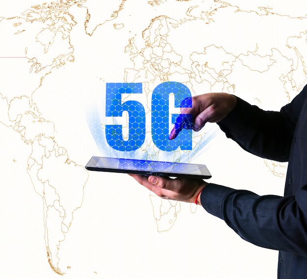 Man is holding tablet with 5G sign. New internet concept. Covering connection all over the world. Dangerous technologies. Modern developments.