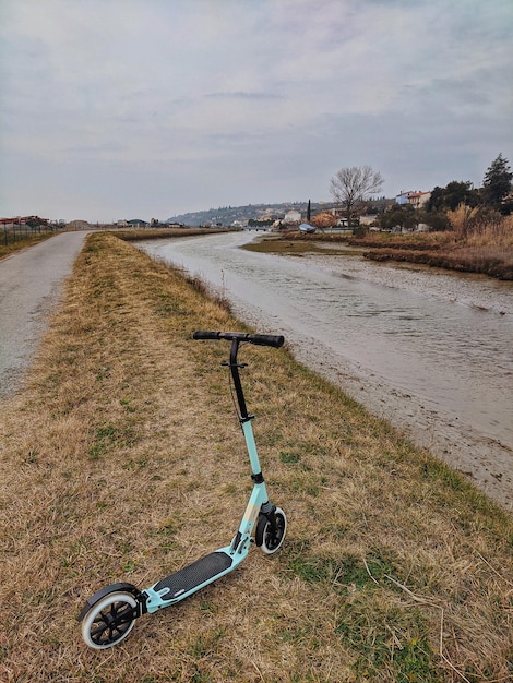 man is riding a regular scooter at city. Active life. Sport concept. Ecological type of transport