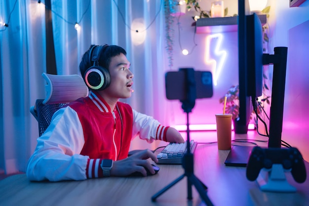 a man is sitting on a couch with headphones on his head